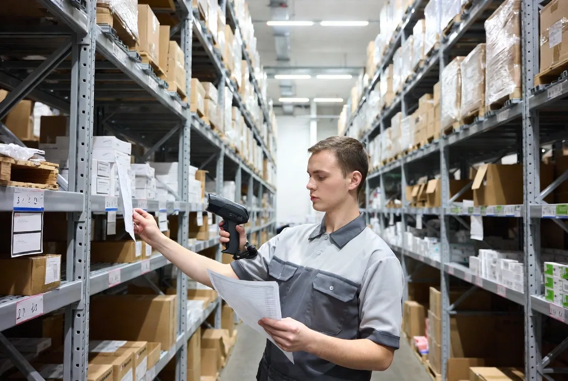 warehouse worker picking items from shelves for order