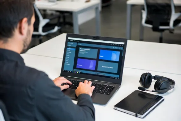 IT support technician working on a laptop diagnosing technical issues