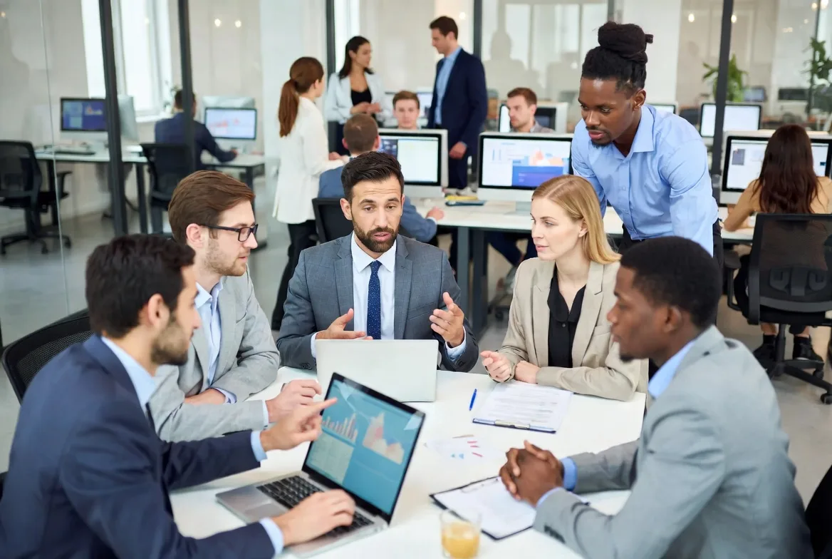 IT team collaborating to improve knowledge base and support efficiency