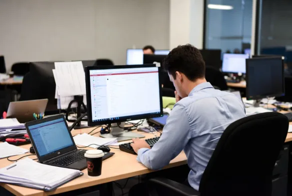 Employee overwhelmed by multiple support requests and emails on computer